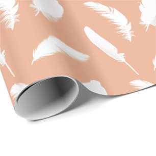 White feather print on soft peach wrapping paper