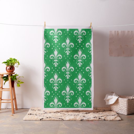 White fleur-de-lis seamless pattern on green fabric