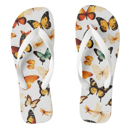 White flip flops with a butterfly design