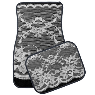 White floral lace: black background. car floor mat