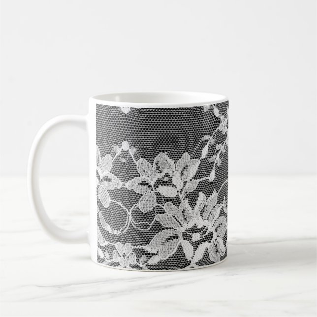 White floral lace: black background. coffee mug (Left)