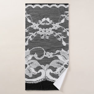 White floral lace on a black background. bath towel