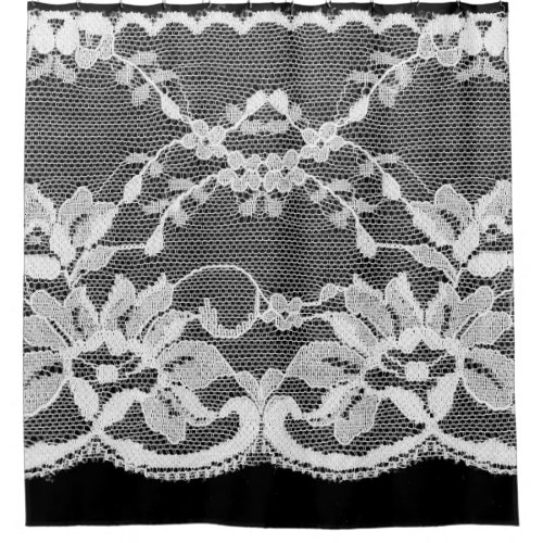 White floral lace on a black background shower curtain