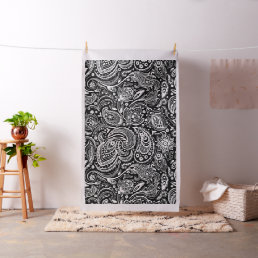 White floral paisley pattern on black fabric