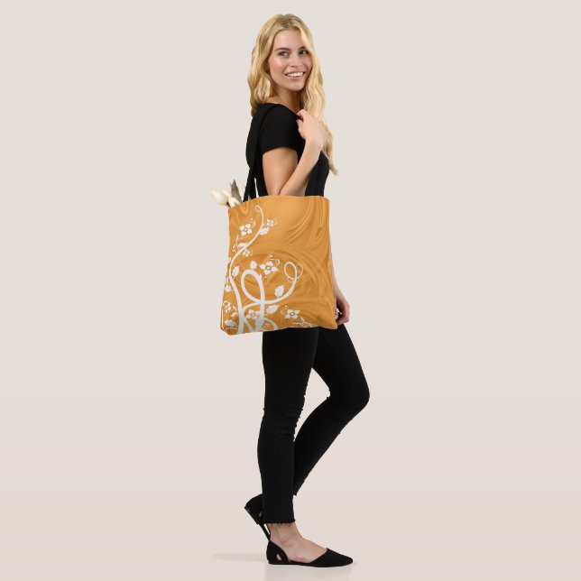 White Flourishes Flowers Shadow Curls Over Orange Tote Bag (On Model)