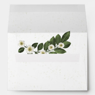 white flowers green leaves white wedding envelope