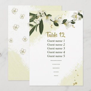white flowers greenery seating chart table number