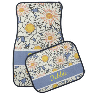 White flowers on blue car floor mat