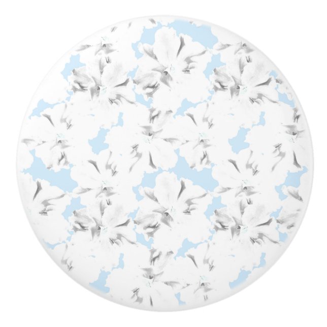 White flowers on light blue. ceramic knob (Front)