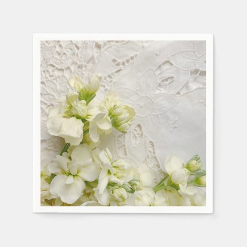 White flowers on old lace napkins