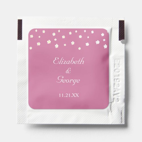 White flowers on rose gold wedding favor hand sanitizer packet