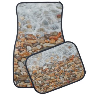 White Foamy Waves Washing Over Colorful Beach Rock