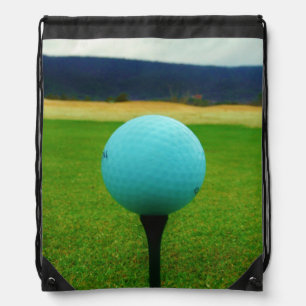 white Golf Ball on a mountain golf course Drawstring Bag