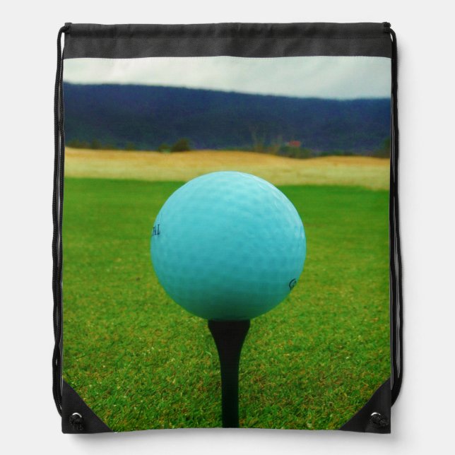 white Golf Ball on a mountain golf course Drawstring Bag (Front)