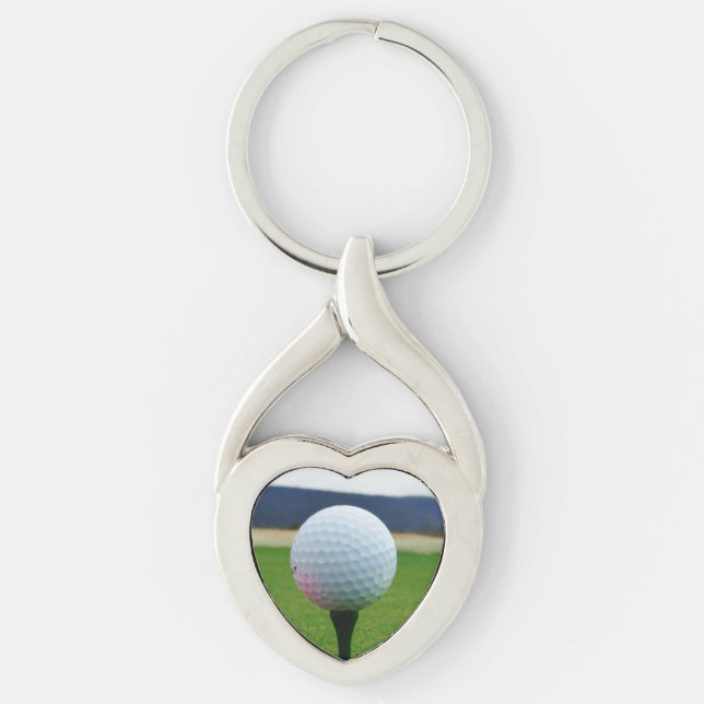 white Golf Ball on a mountain golf course Keychain (Front)