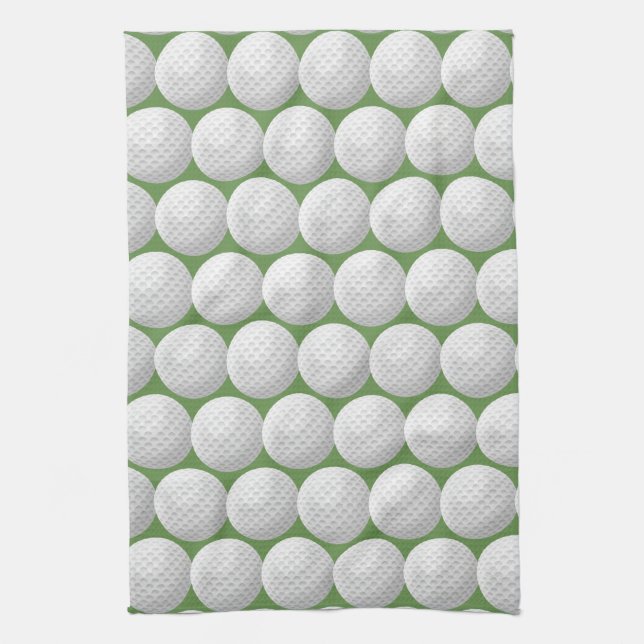 white golf balls on green kitchen towel (Vertical)