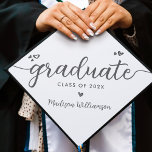 White Gray Simple Modern Elegant Script Hearts Graduation Cap Topper<br><div class="desc">Your favorite grad will stand out and make a statement when they wear this graduation cap topper! Let them celebrate their milestone with this girly, stunning, simple, modern, custom graduation keepsake. A fun, playful visual of soft gray script handwriting and cute, playful hearts, along with her name and class year,...</div>