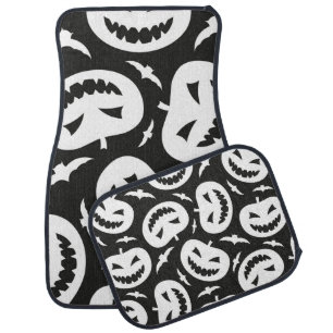 White halloween pumpkins and bats isolated on blac car floor mat