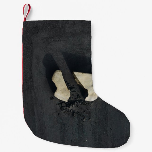 White heart shaped on black surface small christmas stocking (Front)