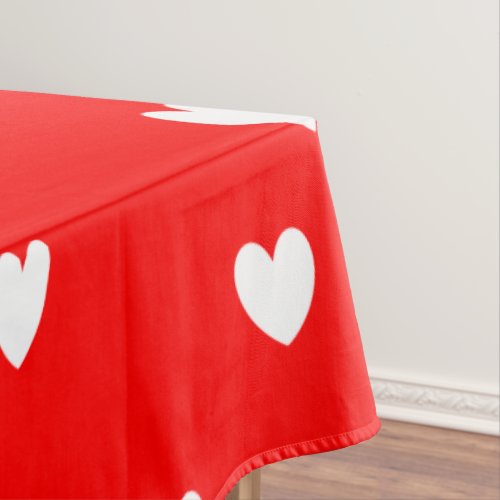 White hearts pattern on red tablecloth