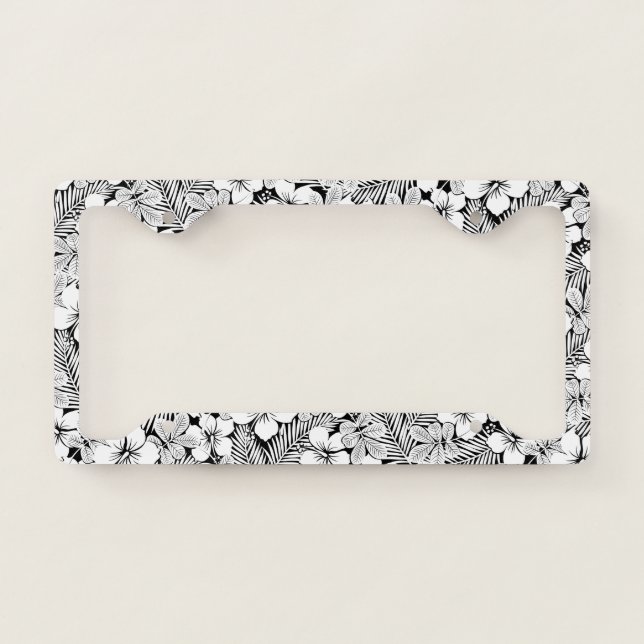 White hibiscus and palm leaves license plate frame (Front)