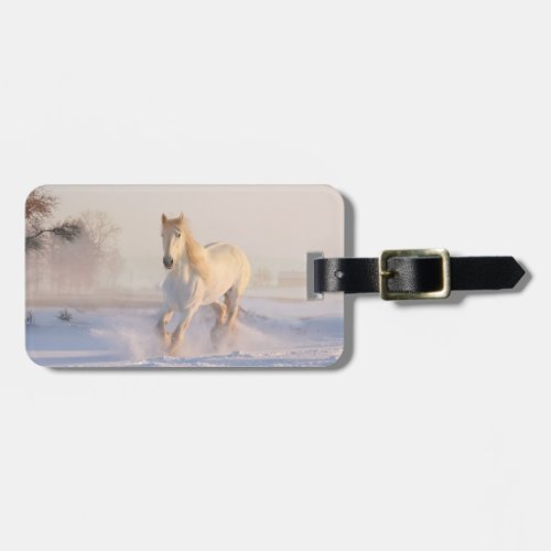 white horse in snow luggage tag