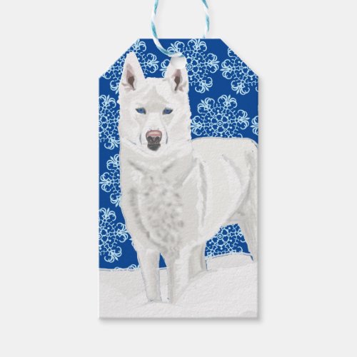 White Husky against Snow Flakes and dark blue sky Gift Tags