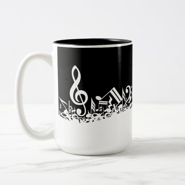 White Jumbled Musical Notes on Black Two-Tone Coffee Mug (Left)