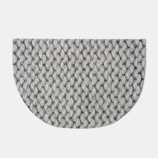 White knitted wool texture, close-up photo. doormat