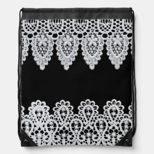 White lace forms a delicate border against black drawstring bag