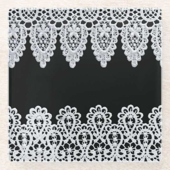 White lace forms a delicate border against black glass coaster (Front)