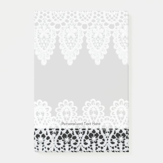White lace forms a delicate border against black post-it notes (Front)