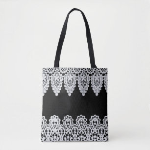 White lace forms a delicate border against black tote bag