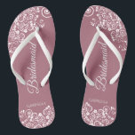White Lace on Dusty Rose Bridesmaid Wedding Flip Flops<br><div class="desc">These beautiful wedding flip flops are a great way to thank and recognize your bridesmaids while saving their feet at the same time. Features a simple yet elegant design with white floral lace filigree on a dusty rose or mauve pink colored background. The elegant script lettering reads Bridesmaid with her...</div>