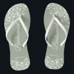 White Lace on Sage Green Bridesmaid Wedding Flip Flops<br><div class="desc">These beautiful wedding flip flops are a great way to thank and recognize your bridesmaids while saving their feet at the same time. Features an elegant design with white floral lace filigree on a dusty purple, lilac, or lavender colored background. The elegant script lettering reads Bridesmaid with her name below....</div>