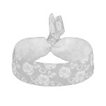 White lace pattern on gray background hair tie
