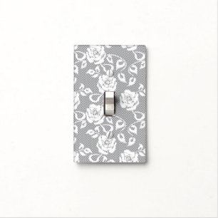 White lace pattern on gray background light switch cover