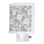 White lace pattern on gray background night light (Left)