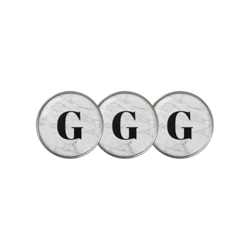 White marble golf ball markers with custom initial
