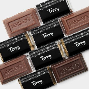 White musical notes on black hershey's miniatures