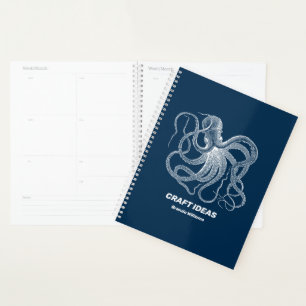 White octopus on dark blue planner