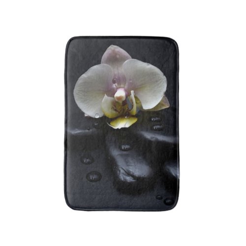 White Orchid On Black Stones Bath Mat