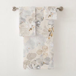 White orchids on a light cream bath towel set
