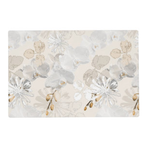 White orchids on a light cream placemat