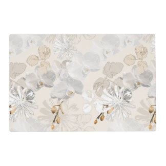 White orchids on a light cream placemat