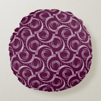 White ornament on a burgundy background. round pillow