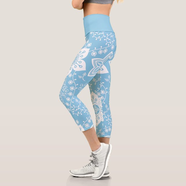 White Paisley Flowers Art Pattern On Light Blue Capri Leggings (Left)
