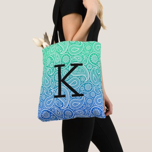 White paisley pattern on blue to green ombre tote bag