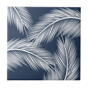 White palm leaves on dark blue color background ceramic tile