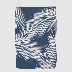 White palm leaves on dark blue color background golf towel